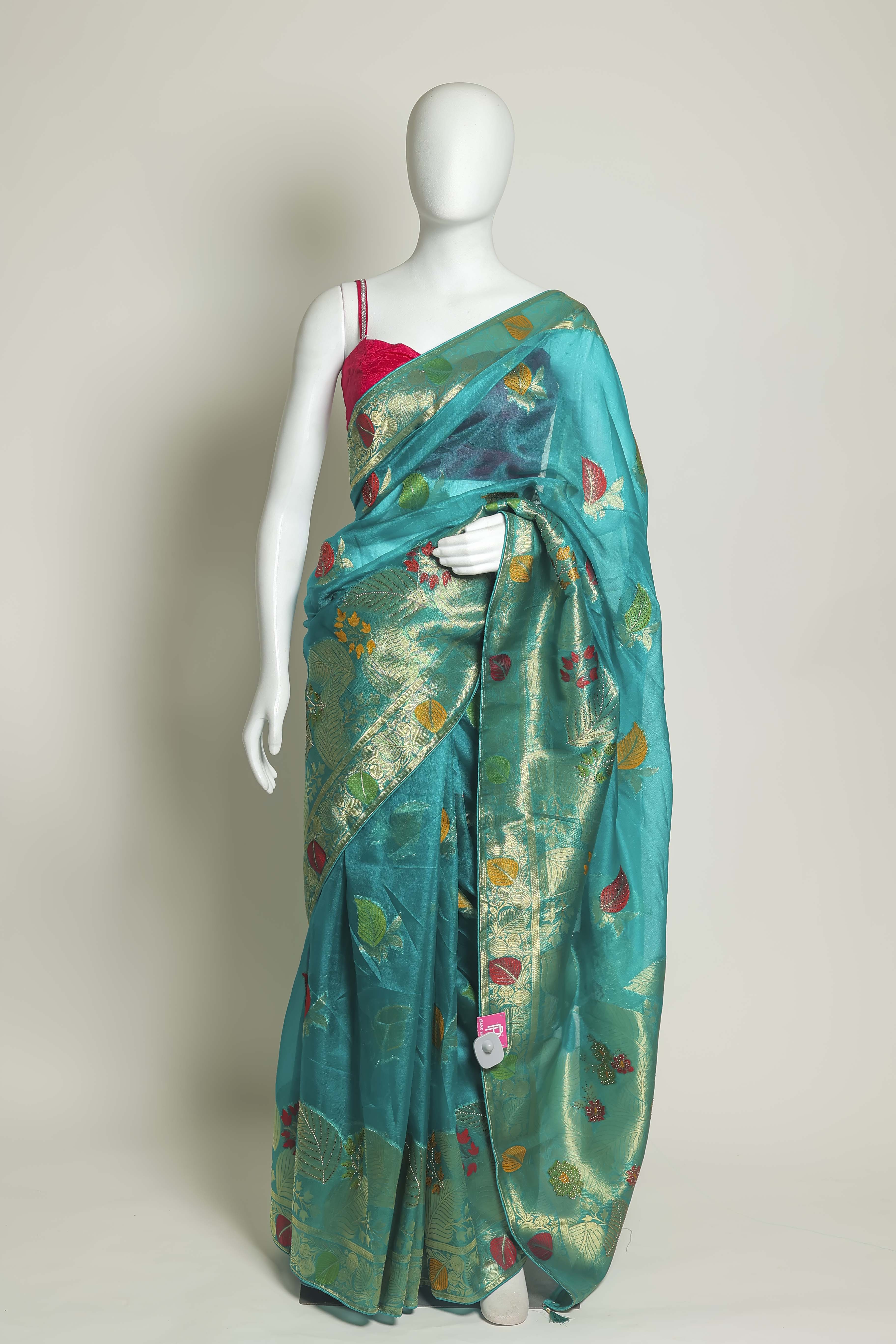 Radiant Firozi Art Organza Saree – Swarovski & Meena Embroidery Elegance